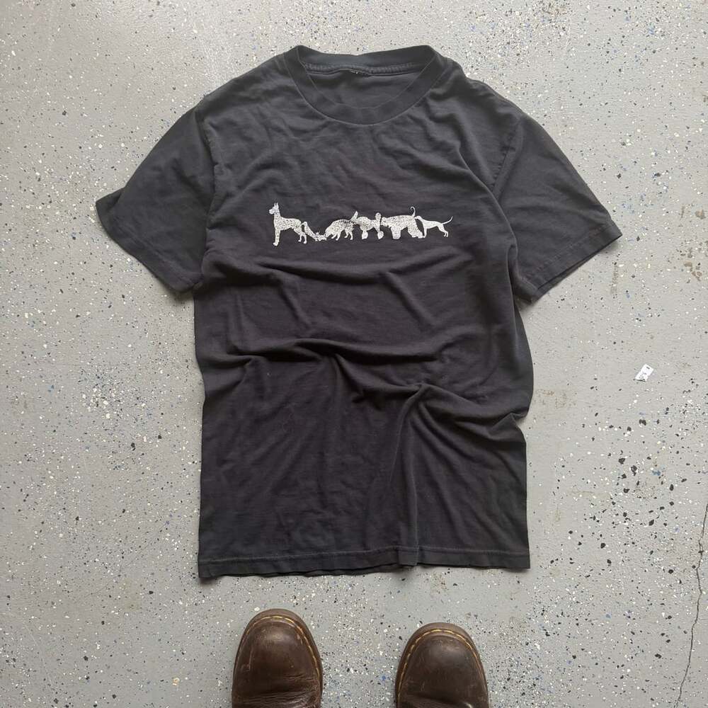 Catzilla Mito T-shirt – Mitosaurus, featuring a line of dog silhouettes